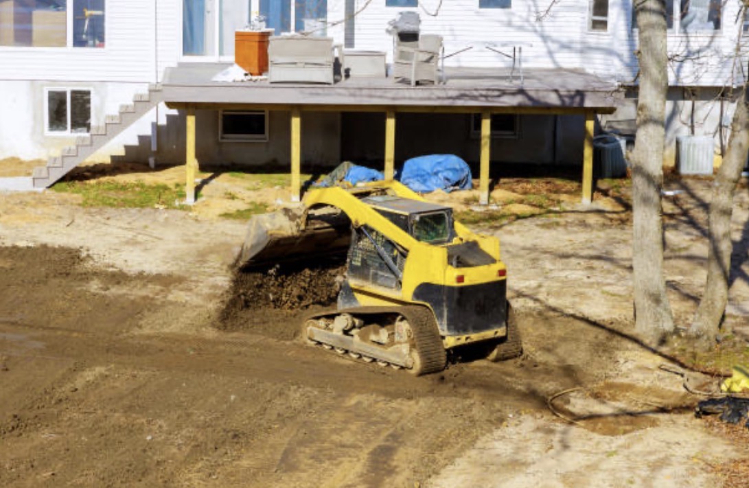 Skid steer grading work